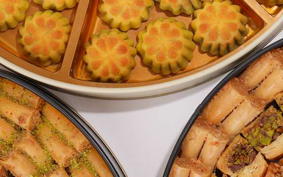 Trays of maamoul and baklava prepared by Sugar Batch