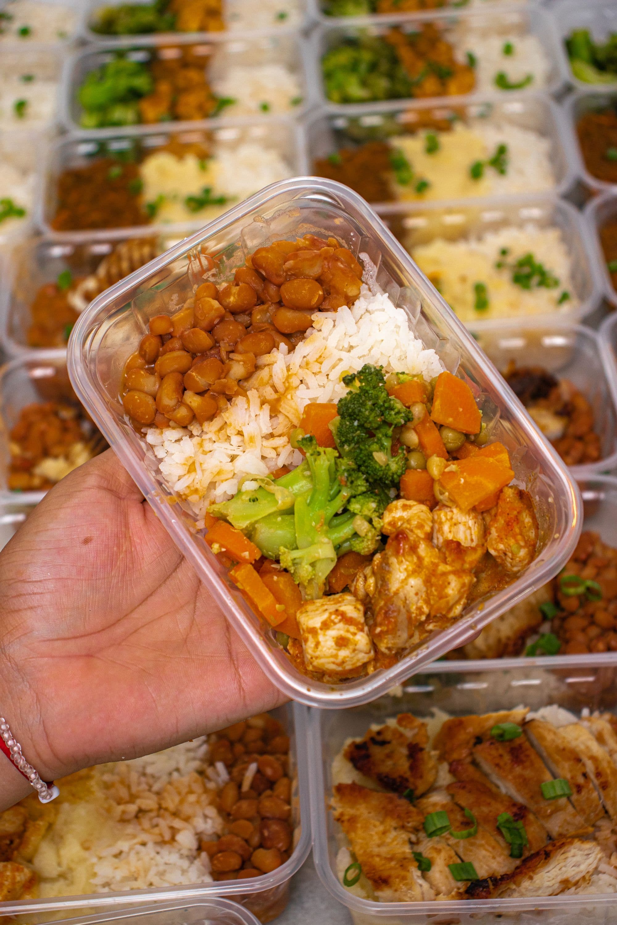 Portioned meal containers in preparation