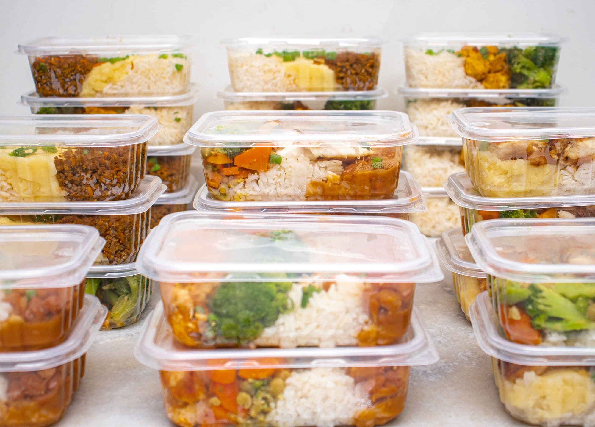 Portioned meal containers on the preparation line