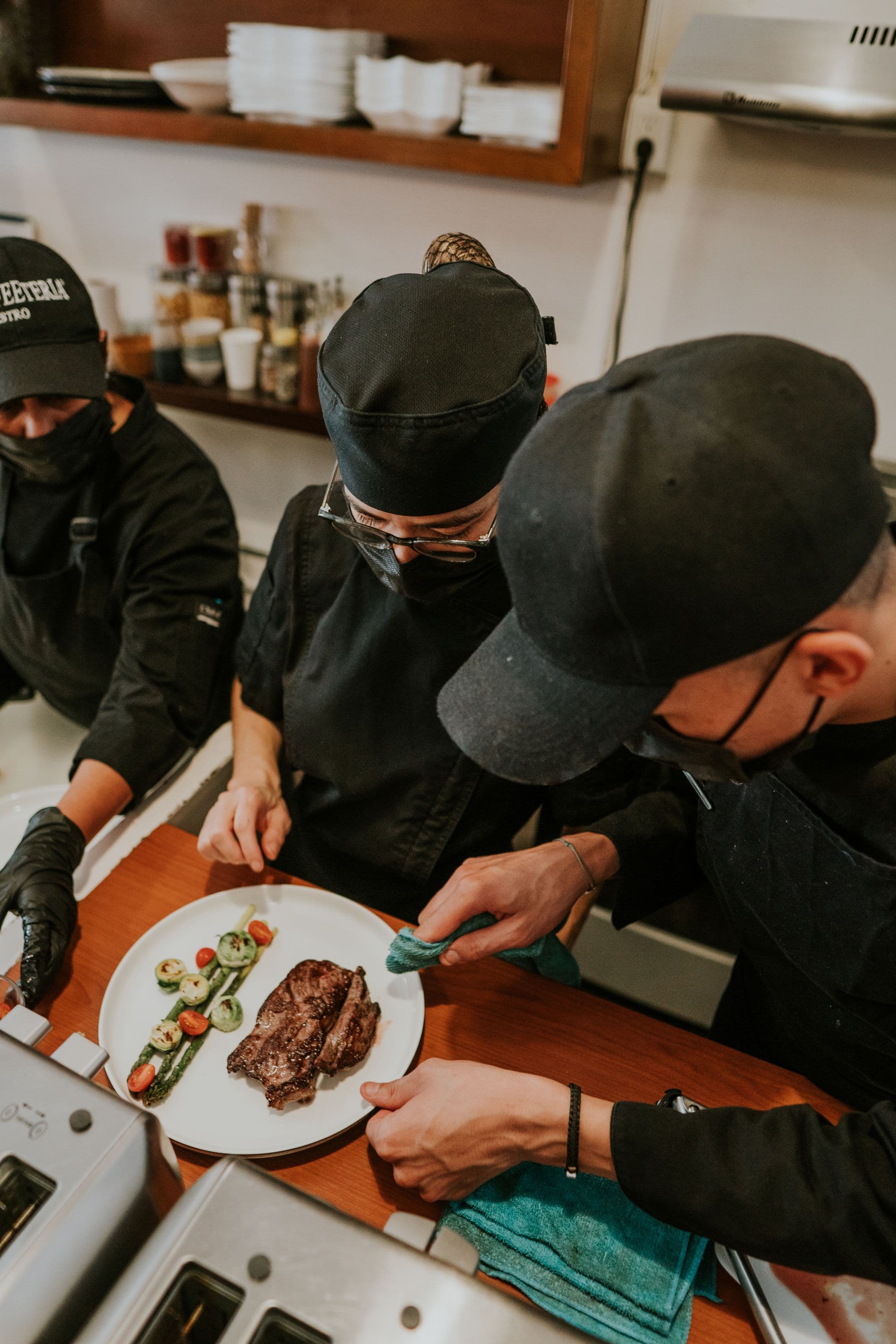 A chef at work in a busy professional kitchen